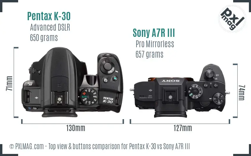 Pentax K-30 vs Sony A7R III top view buttons comparison