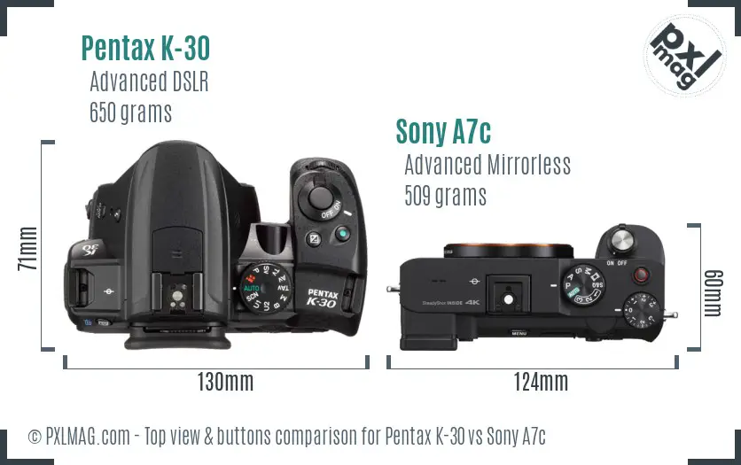 Pentax K-30 vs Sony A7c top view buttons comparison