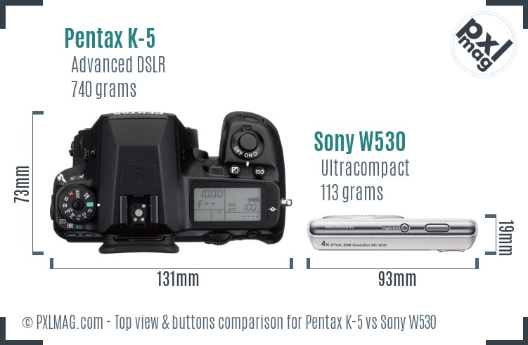 Pentax K-5 vs Sony W530 top view buttons comparison
