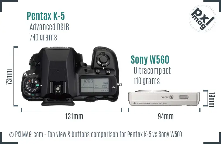 Pentax K-5 vs Sony W560 top view buttons comparison