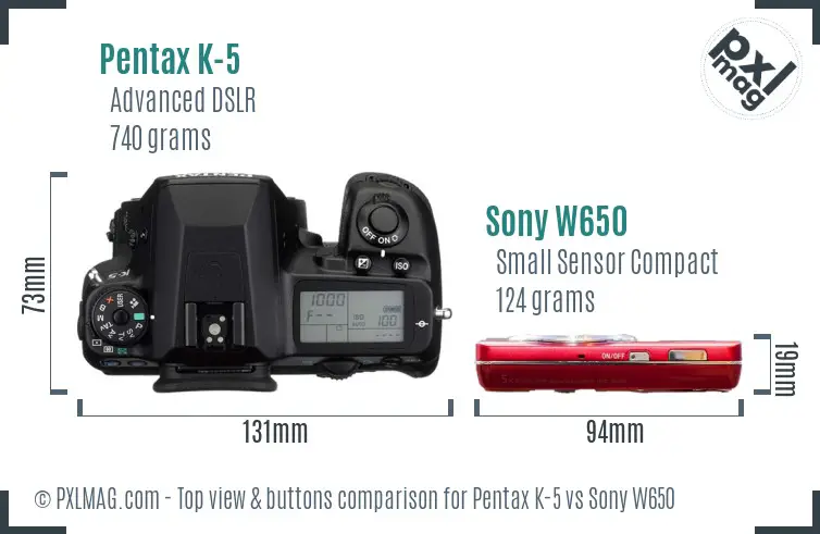 Pentax K-5 vs Sony W650 top view buttons comparison