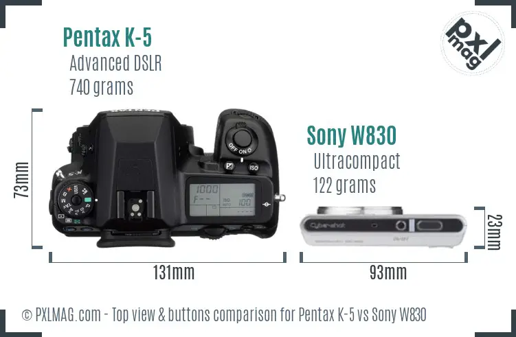 Pentax K-5 vs Sony W830 top view buttons comparison