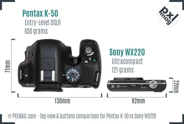 Pentax K-50 vs Sony WX220 top view buttons comparison