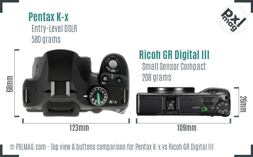 Pentax K-x vs Ricoh GR Digital III top view buttons comparison