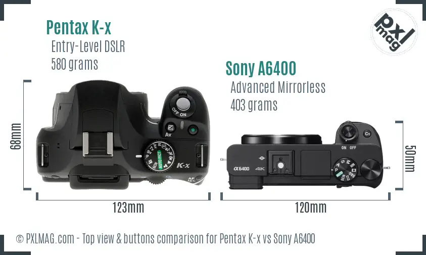 Pentax K-x vs Sony A6400 top view buttons comparison