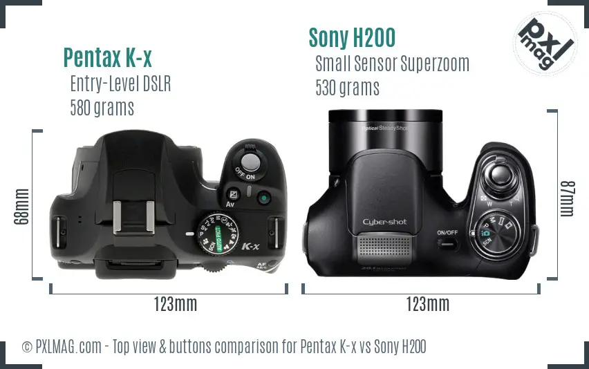 Pentax K-x vs Sony H200 top view buttons comparison Pentax K-x vs Sony H200 top view buttons comparison