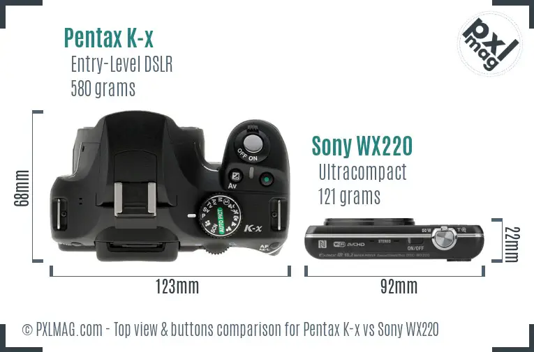 Pentax K-x vs Sony WX220 top view buttons comparison