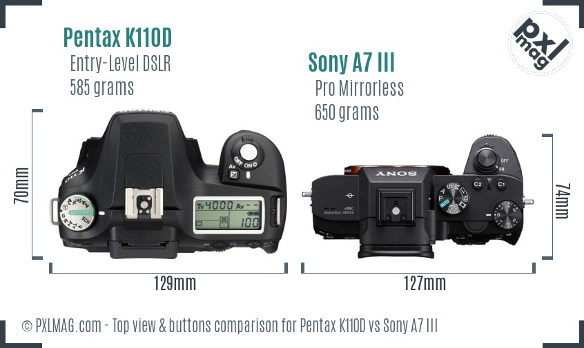 Pentax K110D vs Sony A7 III top view buttons comparison